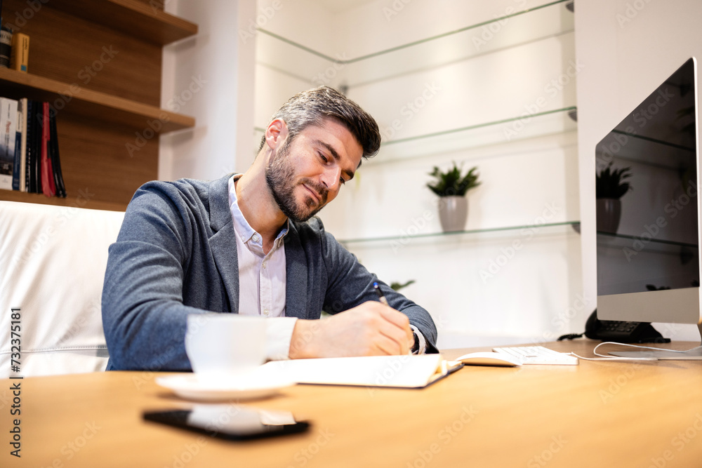 Positive smiling manager working in the office. Positive smiling manager working in the office.