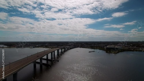 Wallpaper Mural Aerial Beautiful View Of Segmental Bridge Over River In Residential City Under Clouds, Drone Flying Forward On Sunny Day - Daytona Beach , Florida Torontodigital.ca