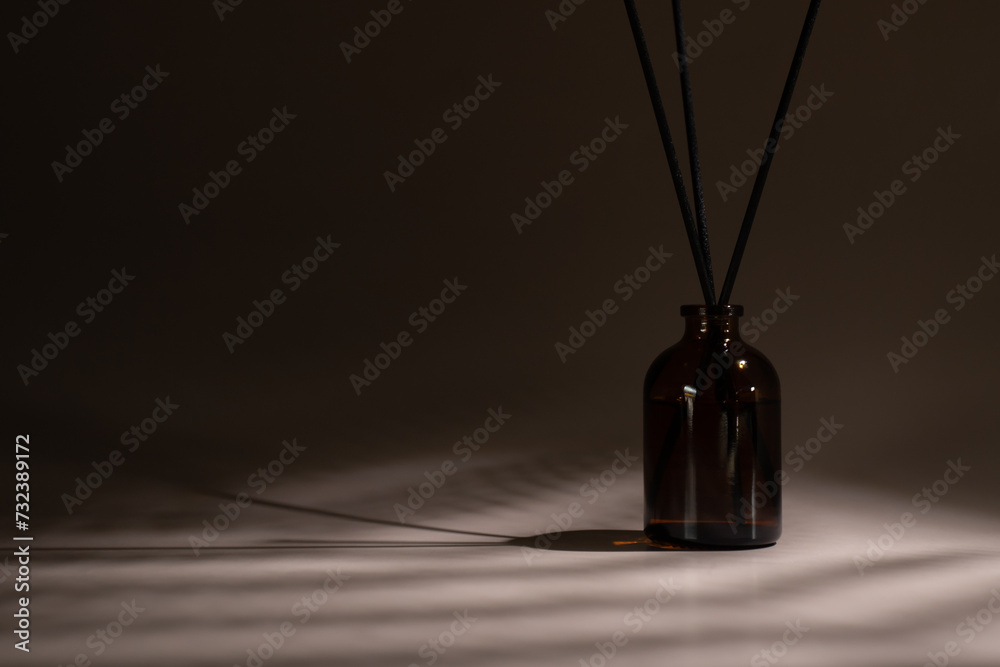 Relaxing atmosphere, natural background, diffuser with reed sticks, spa ambiance