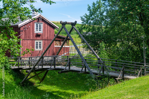 Old farm house and wooden bridge 