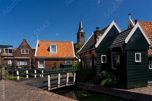 Beautiful fishing village of Volendam with with its typical houses in a sunny day. Netherlands.