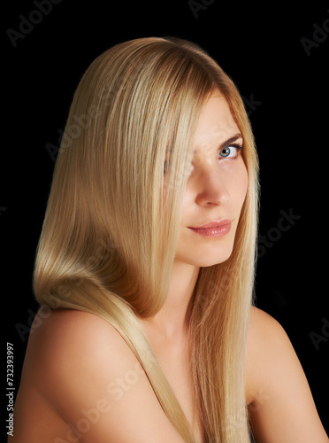 Beauty, hair and portrait of woman with blonde hairstyle, salon care and keratin treatment isolated in dark studio. Styling, glow and face of girl with healthy haircare shine on black background.