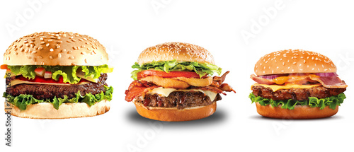 Floating burger isolated on black wooden background. Ingredients of a delicious burger with ground beef patty, lettuce, bacon, onions, tomatoes and cucumbers