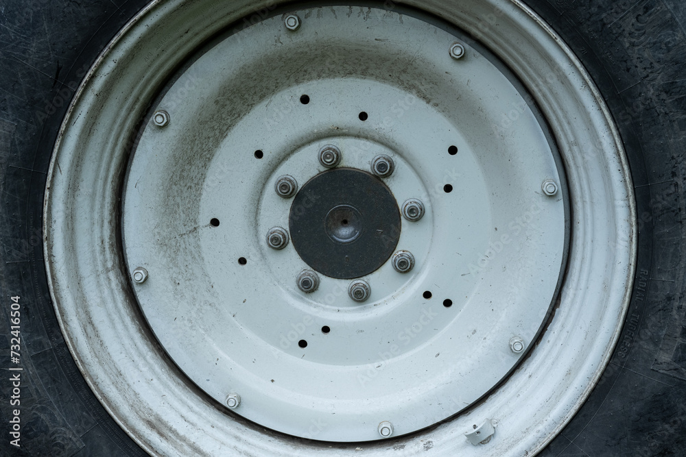 White wheel hub of a tractor. White wheel hub of a tractor.
