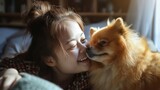 A young woman with a radiant smile lovingly kissing the nose of her adorable fluffy brown Pomeranian dog creating a heartwarming moment of affection and joy.