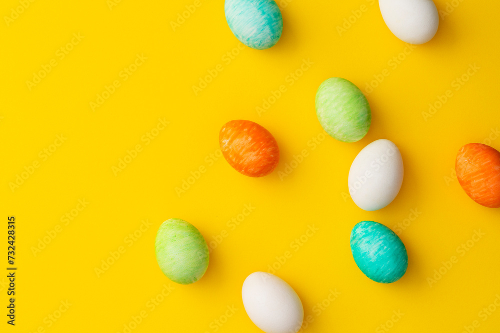 Hand painted colorful easter eggs on yellow background. Hand painted colorful easter eggs on yellow background.