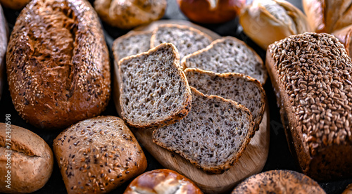 Assorted bakery products including loaves of bread and rolls