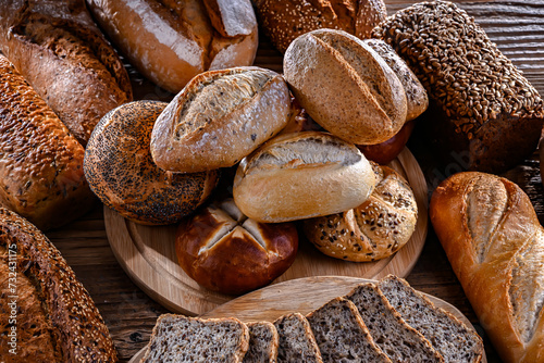 Assorted bakery products including loaves of bread and rolls