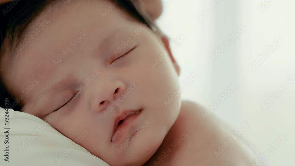 Close up infant or newborn baby face baby feel sleepy Happy single mom carrying small baby on shoulder protect serene sleep taking care of health comfort safety little child Mom lull baby sleeping Close up infant or newborn baby face baby feel sleepy Happy single mom carrying small baby on shoulder protect serene sleep taking care of health comfort safety little child Mom lull baby sleeping