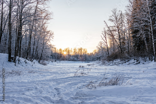 winter landscape on a pond. beautiful winter sunset. snowy nature landscape