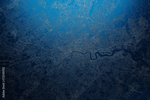 Street map of London (UK) engraved on blue metal background. View with light coming from top. 3d render, illustration photo