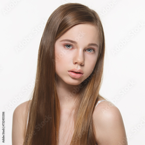 Beauty Nude portrait of a girl with long hair isolated on white background