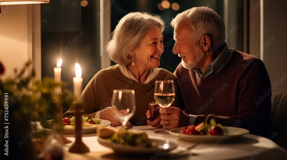 Senior couple enjoying a romantic candlelit dinner at home