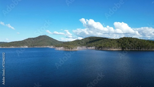Wallpaper Mural Scenic aerial view of a tranquil lake surrounded by lush green hills, creating a tranquil atmosphere Torontodigital.ca