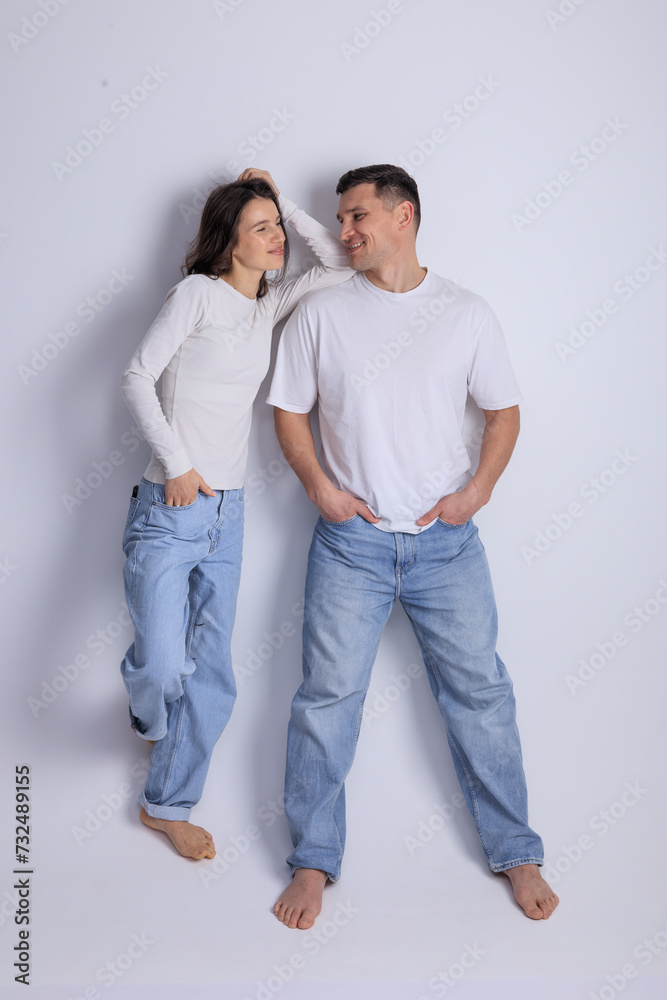 This captivating minimalist portrait features a couple in a quiet embrace, bathed in soft light. This captivating minimalist portrait features a couple in a quiet embrace, bathed in soft light.