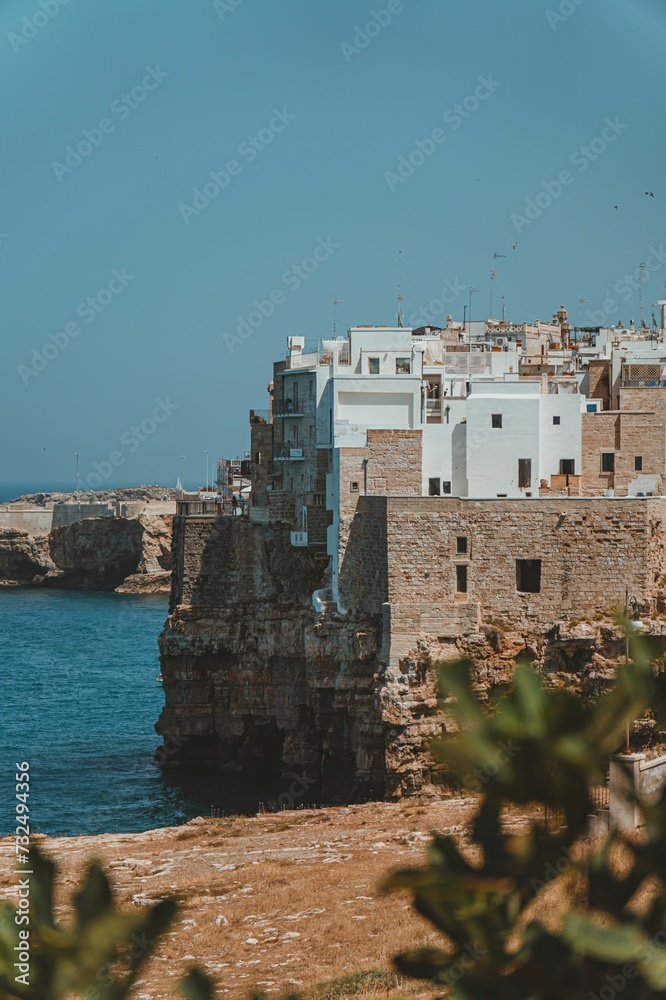 Scenic view of antique houses against the sea in Bari, Italy on a sunny day