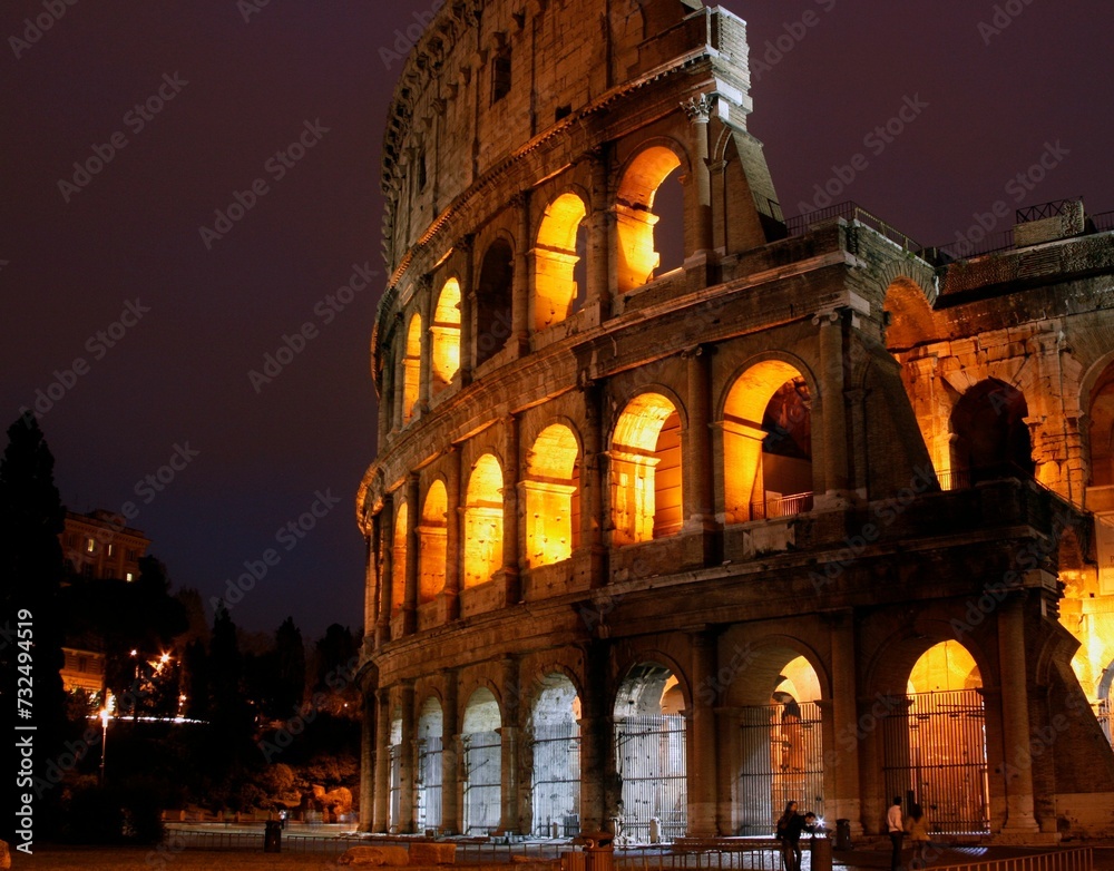 Scenic view of Colosseum illuminated at night in Rome, Italy