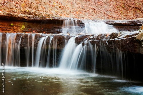 Scenic view of a waterfall cascading down a rocky cliff