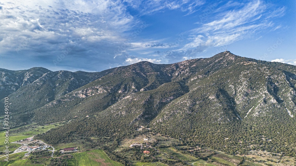 Aerial view of a scenic mountain range and valley in bright daylight