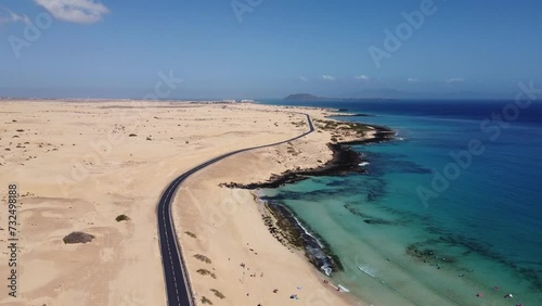 Aerial view of road crossing Corralejo Dunes Natural Park, Fuerteventura, Canary Islands, Spain. Alzada beach.