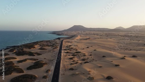 Aerial view of road crossing Corralejo Dunes Natural Park, Fuerteventura, Canary Islands, Spain. Alzada beach.