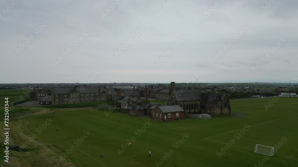 Drone view over country houses on a green field Drone view over country houses on a green field