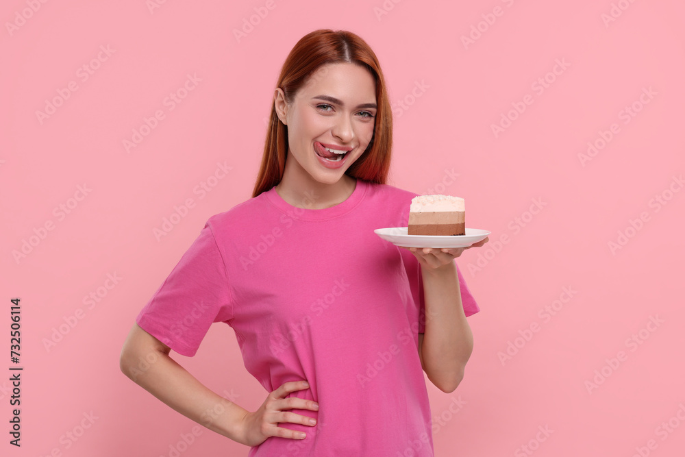 Young woman with piece of tasty cake on pink background Young woman with piece of tasty cake on pink background