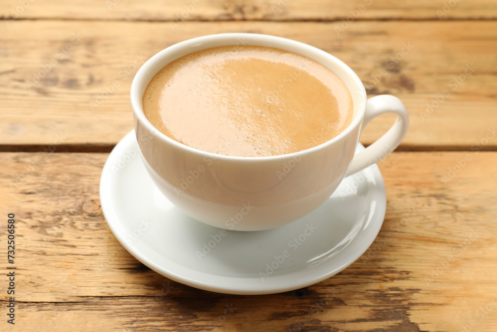 Cup of aromatic coffee on wooden table, closeup Cup of aromatic coffee on wooden table, closeup