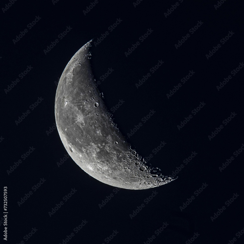 Illuminated full moon visible against the backdrop of a star-filled night sky Illuminated full moon visible against the backdrop of a star-filled night sky