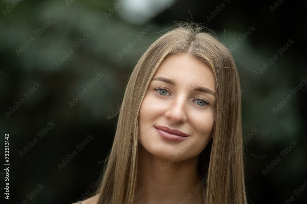 Portrait of a young beautiful blonde girl in a city summer park. Portrait of a young beautiful blonde girl in a city summer park.