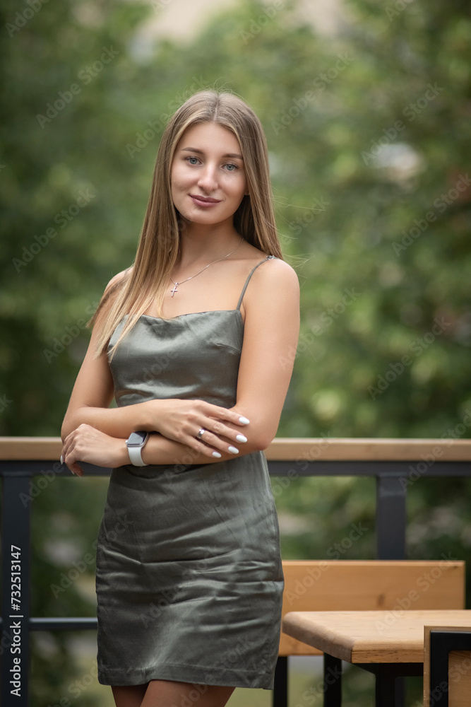 Portrait of a young beautiful blonde girl in a city summer park. Portrait of a young beautiful blonde girl in a city summer park.