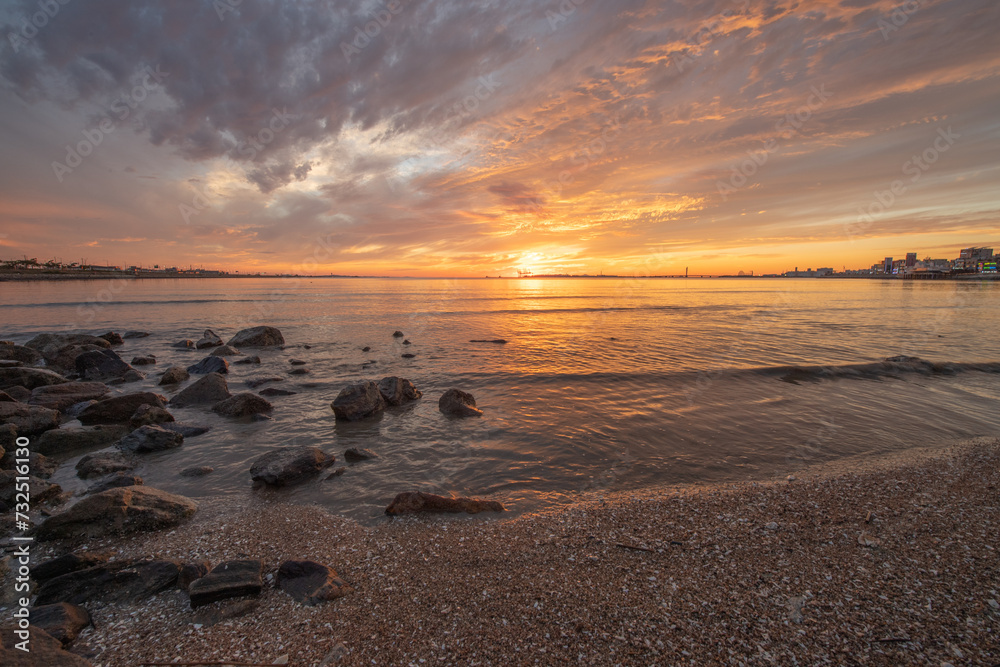 Beautiful sunset on the beach and beautiful clouds in the sky
