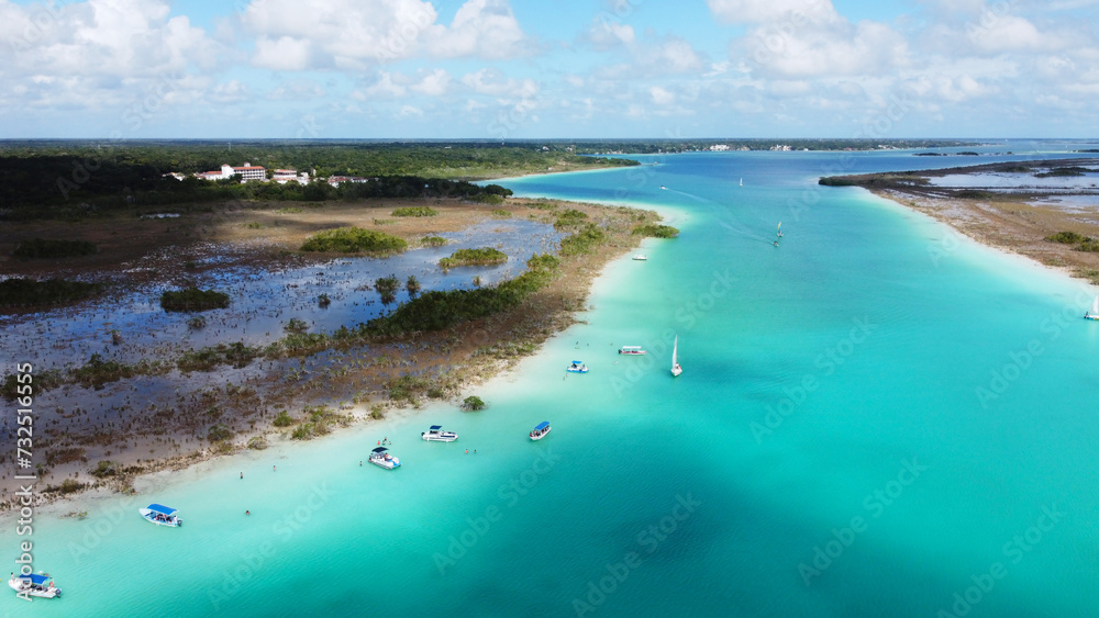 Fototapeta premium Aerial Drone view of the Pirate Channel of Bacalar Quintana roo, Cancun, in Riviera Maya, Mexico Lagoon of seven colors aerial view.