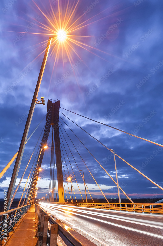 Cable-stayed bridge at sunset against a beautiful sky and in the rays of evening lighting. Murom. Russia.