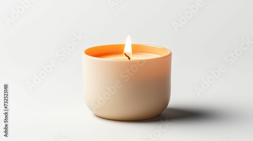 Lit Candle on White Table