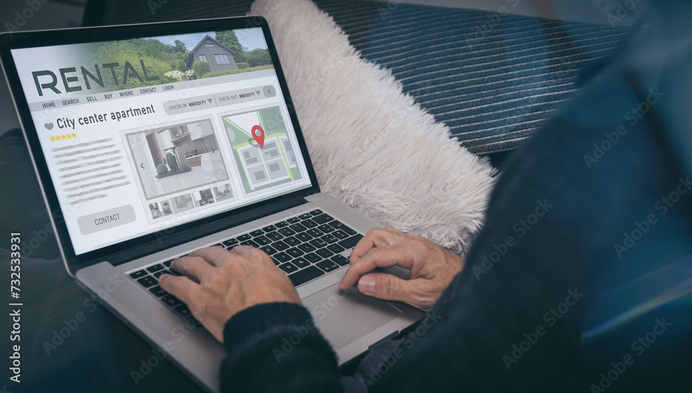 Fototapeta premium Man reading rental home ads online. Booking vacation in house for rent. Travel, business, concept.