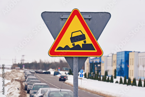 Soft verges, Warning sign, traffic sign and cars parked in row along dangerous snowy roadside on background. Soft verge road sign, car parked with traffic violation. Dangerous parking on soft roadside