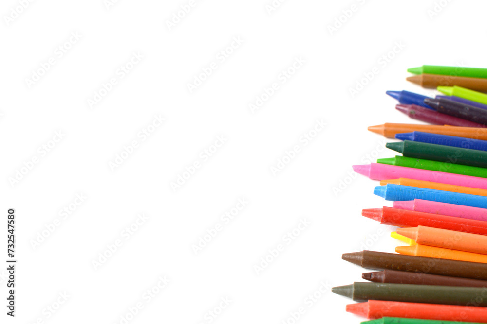 Crayons lined up isolated on white background.