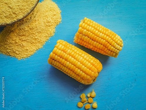  yellow corn and cornmeal on blue background