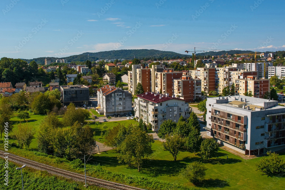 Fototapeta premium An aerial view over a residential district of Karlovac, south of the historic centre, in Central Croatia. The city railway line is in the foreground