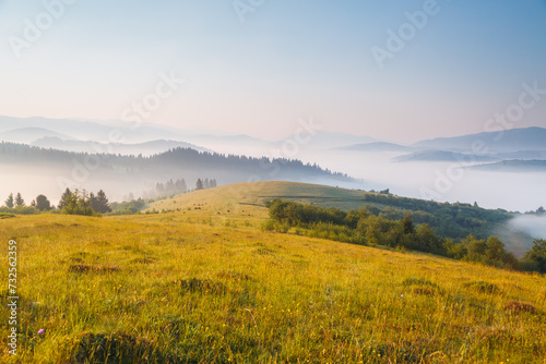 Peaceful view of the mountainous area with fog in the morning. Carpathian National Park  Ukraine  Europe.