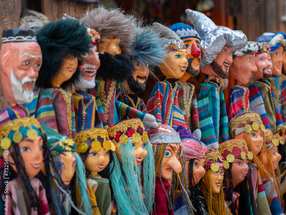 Naklejka premium Collection of hand made colorful dolls on traditional Uzbek dress in local market, Khiva, Uzbekistan