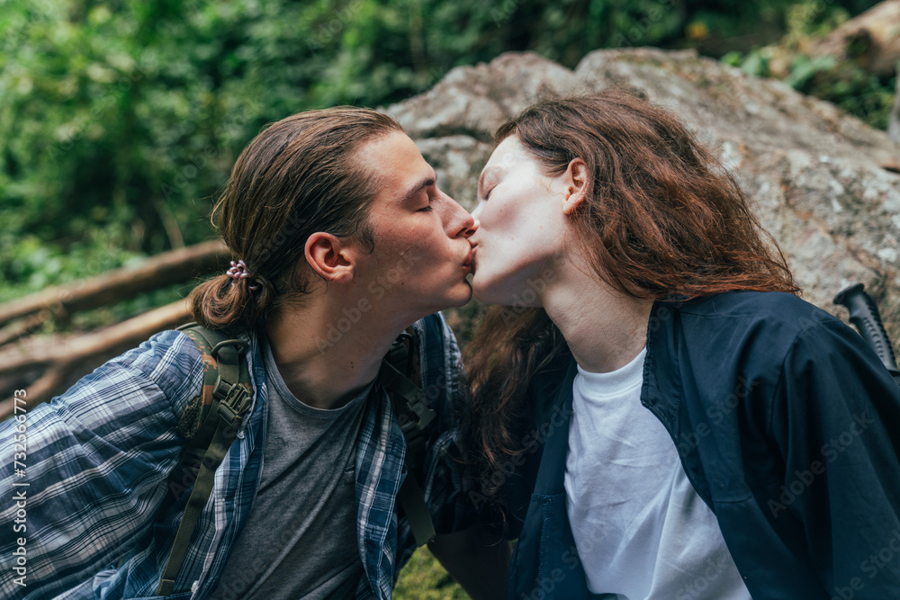 Fototapeta premium The happy couple is hiking in the forest. going on a camping trip. Man and woman backpackers lover concept.