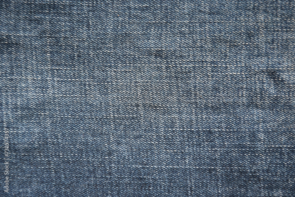 Close up view to space of empty light blue natural clean denim texture Close up view to space of empty light blue natural clean denim texture