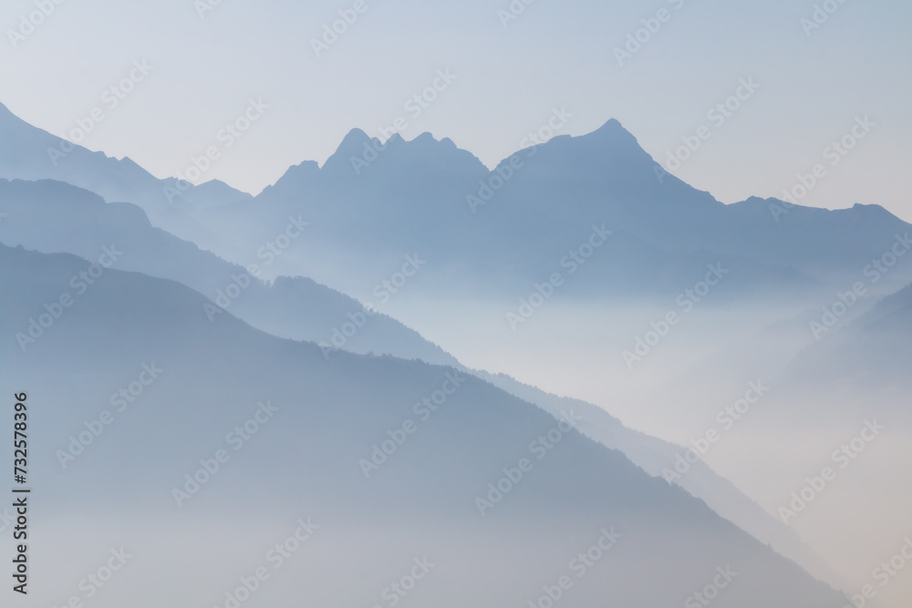 Spectacular mountain ranges silhouettes in morning.