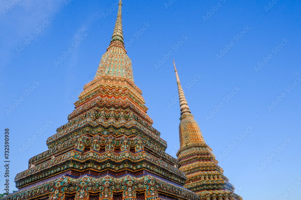 Wat Arun Pagoda with blue sky and sunlight, A Buddhist temple in Bangkok, Thailand