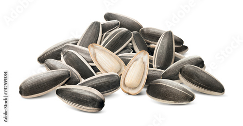 Sunflower seeds pile with two open seeds in the middle isolated on white background