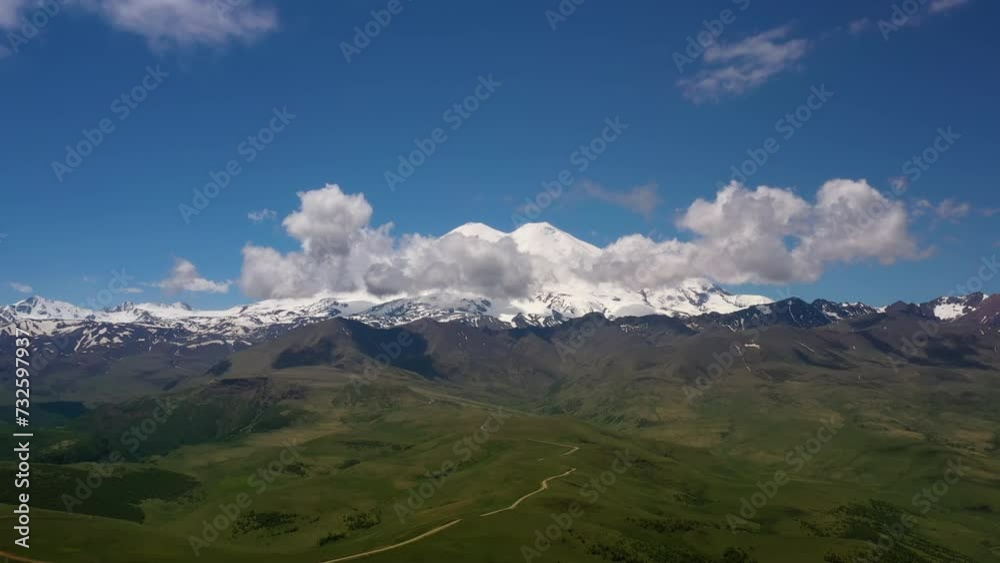 Elbrus Region. Flying over a highland plateau. Beautiful landscape of nature. Mount Elbrus is visible in the background. Elbrus Region. Flying over a highland plateau. Beautiful landscape of nature. Mount Elbrus is visible in the background.