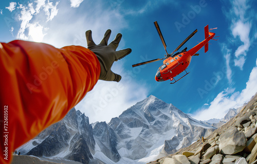 Climber greetings Medical Rescue helicopter landing in high altitude Himalayas mountains during mount expedition climbing. Travel, active people, safety and Traveling insurance concept wide POV image. photo