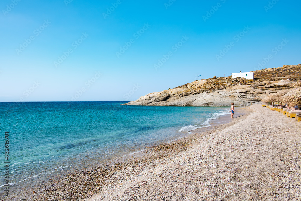 Lia Beach, wild and free beach in the south of Mykonos, Greece. Pristine bay with blue sea and crystal water, famous for naturism and Scuba diving school, peaceful and quiet.